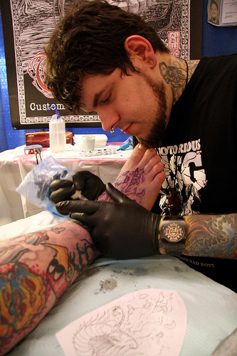 Boe Mencarelli Tattoo artist Boe Mencarelli works on a tattoo at Key West